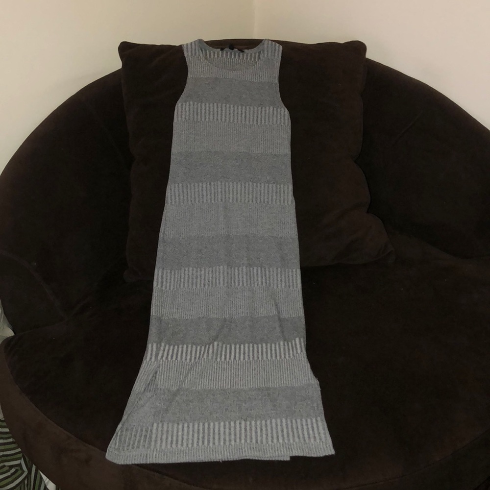 Grey skintight dress, goes a bit past the knees.